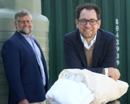 Luke Terry, the head of White Box Enterprises, with Beacon Laundry’s Anthony Dann, pictured back left.