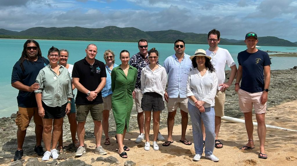 A group of people standing on the beach in Far North Queensland